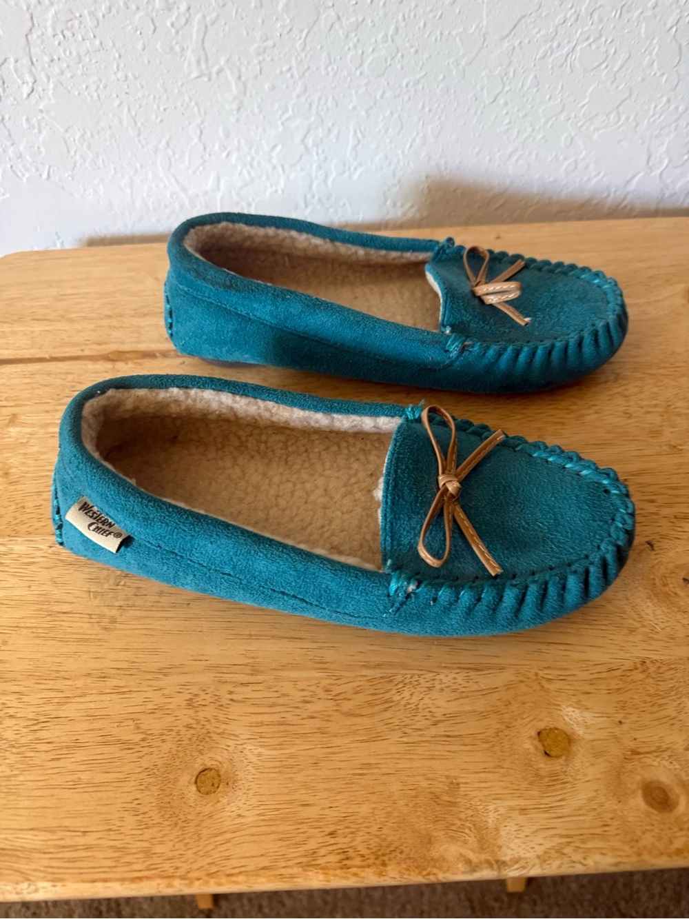 Western Chief Teal Moccasin Slippers with Tan Bow
